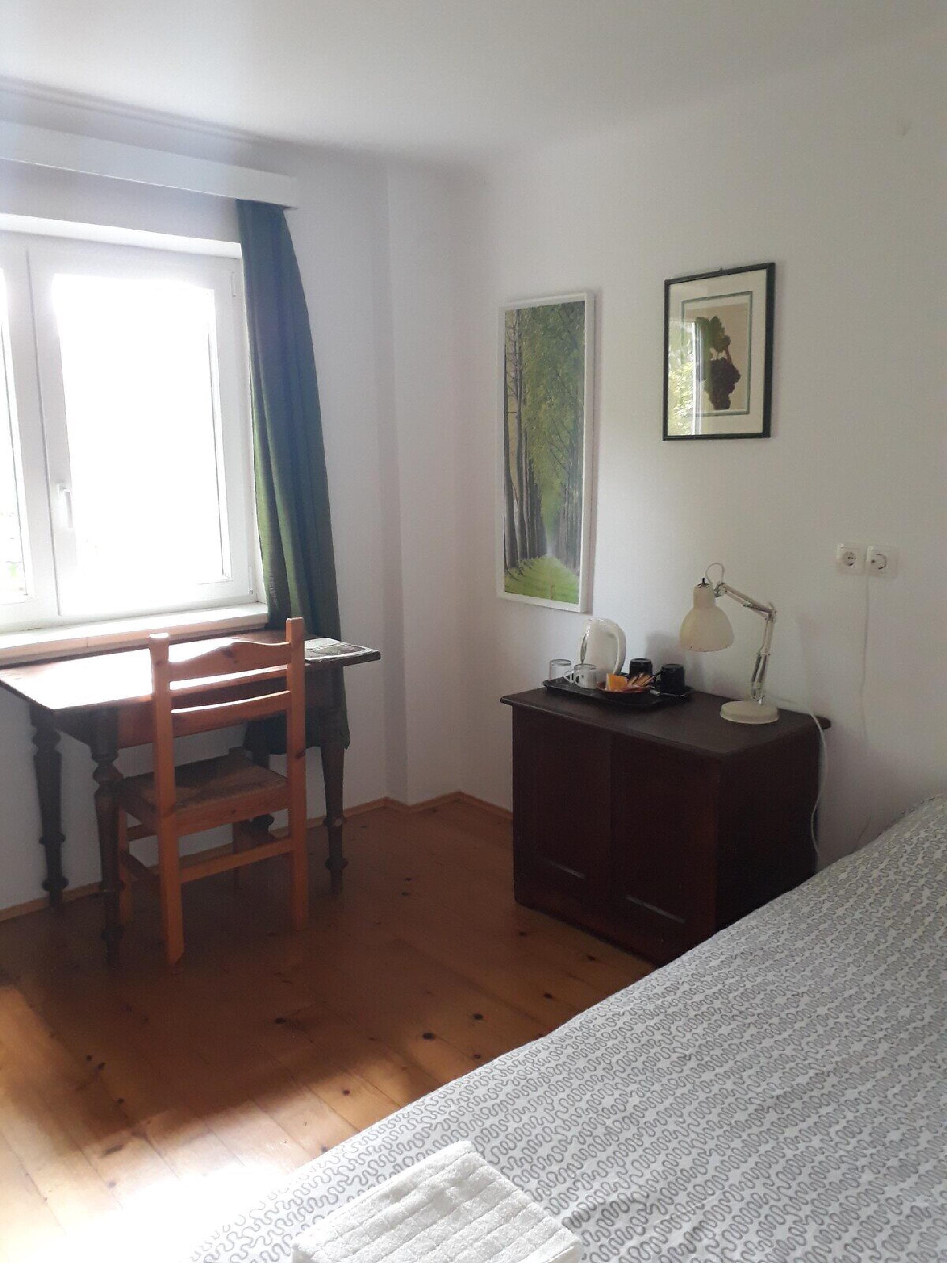 A small, private room in the converted barn — one double bed, shared bathroom, ideal for a couple.